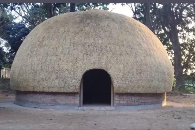 A clean, precisely finished dome roof on a brick foundation.