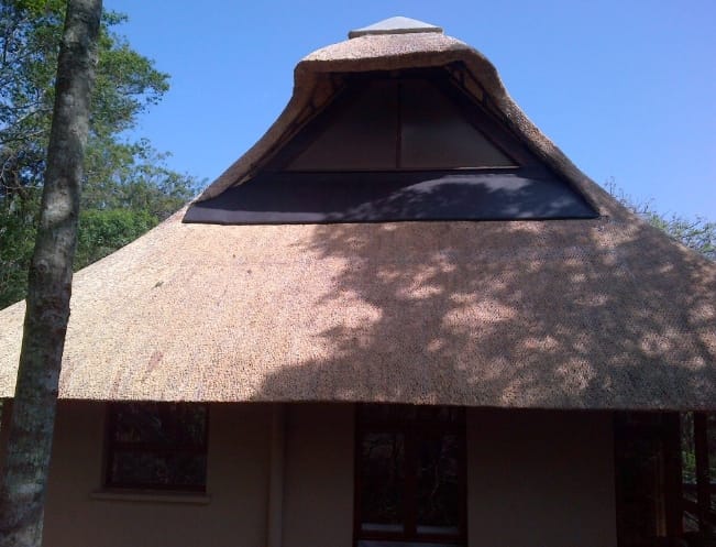 A close-up of the finished thatch dormer window detailing.