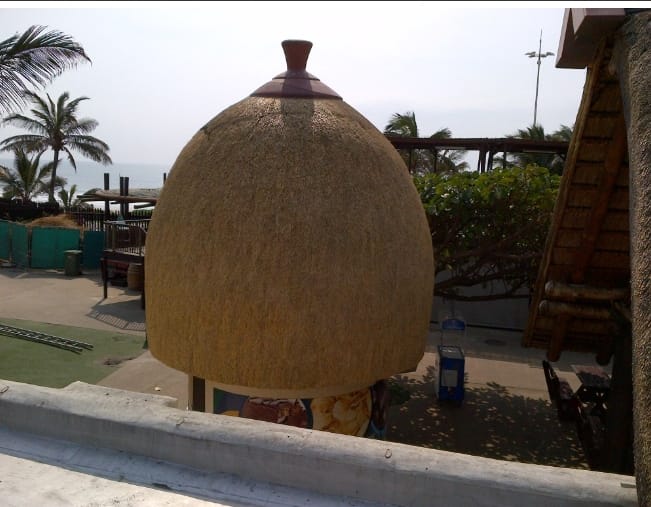 A domed thatch tower overlooking the beachfront.