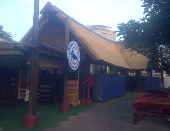 A thatched storefront structure at uShaka Marine World.